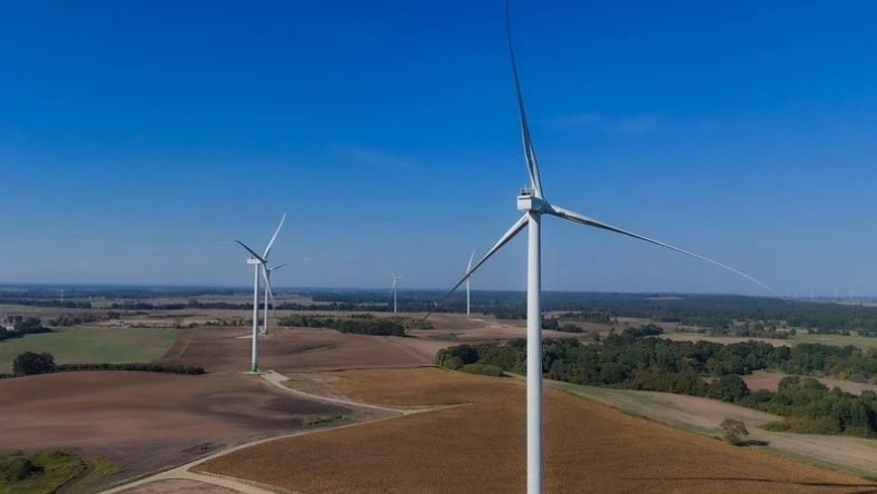 Onshore wind turbines generating renewable energy in rural landscape