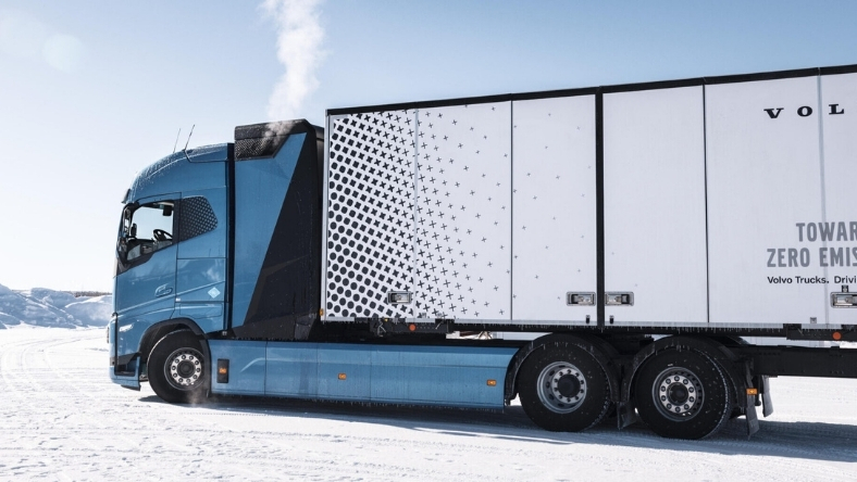 Volvo heavy-duty truck driving through snowy terrain